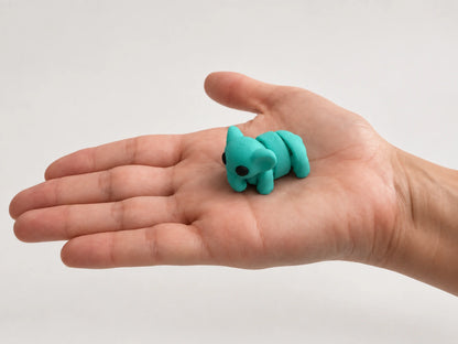 Elsie (Elephant) articulated fidget resting in an open hand.