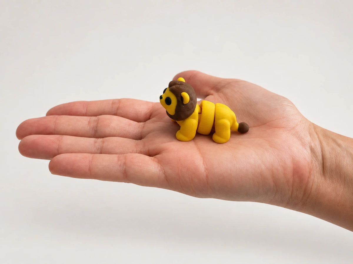 Lion Fidget articulated fidget resting in an open hand.