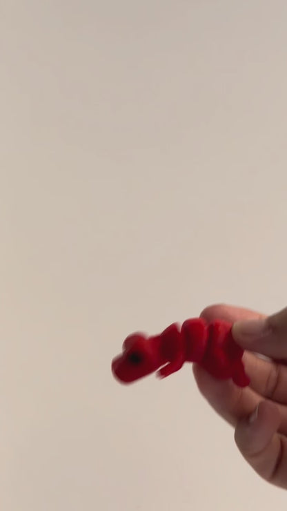 Timmy (T-Rex) shown moving in a hand.