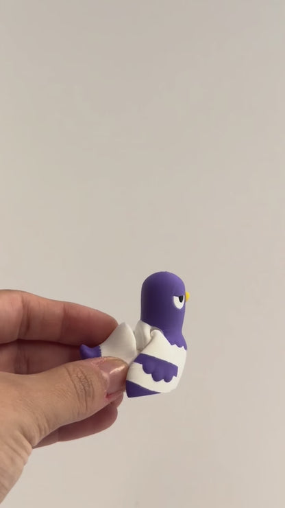 Peter Pigeon shown moving in a hand.