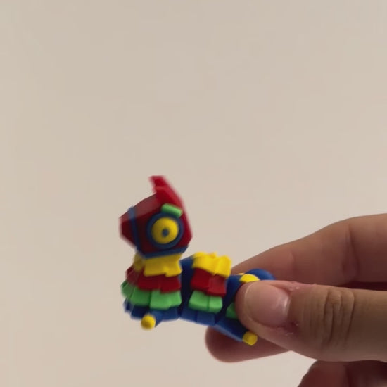 Pinata Chonk shown moving in a hand.
