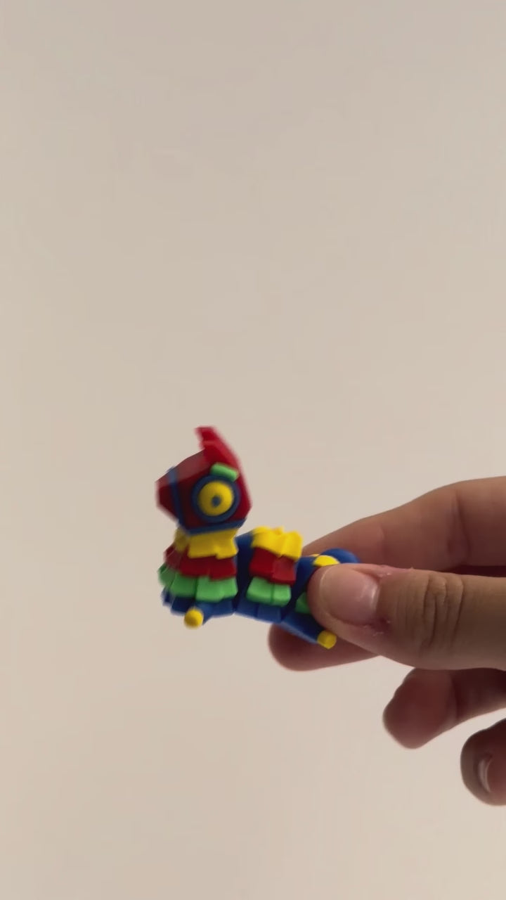 Pinata Chonk shown moving in a hand.