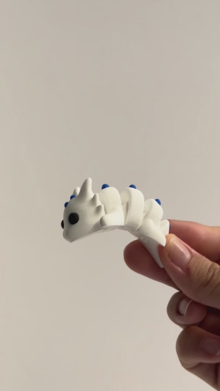 Dragon Fidget shown moving in a hand.