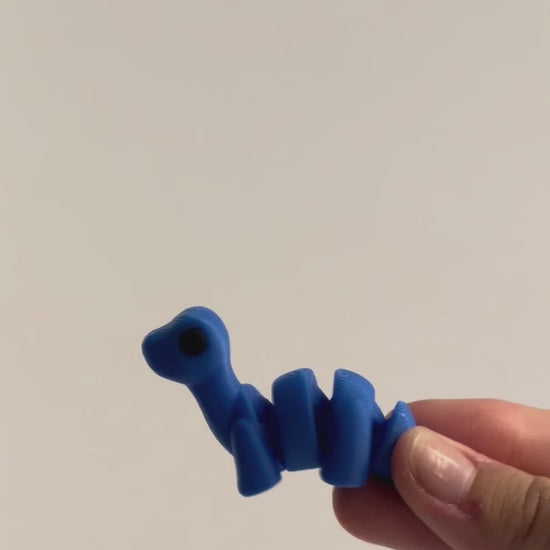 Dip (Diplodocus) shown moving in a hand.