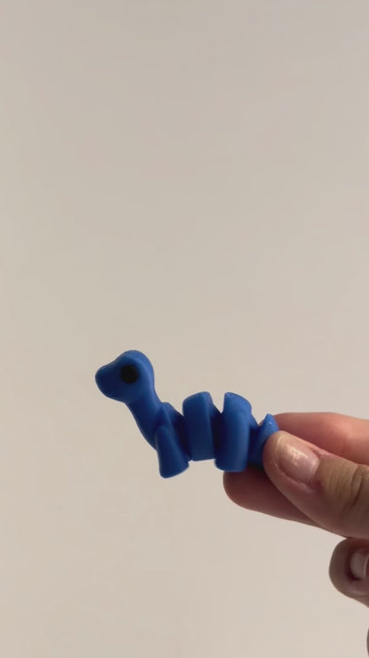 Dip (Diplodocus) shown moving in a hand.