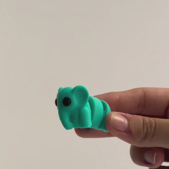 Elsie (Elephant) shown moving in a hand.