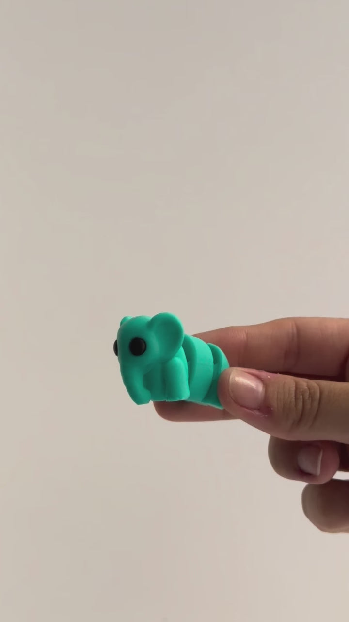 Elsie (Elephant) shown moving in a hand.