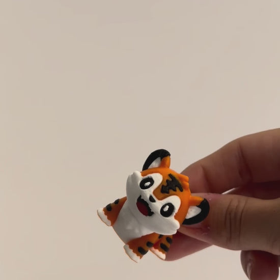 Tony Tiger shown moving in a hand.