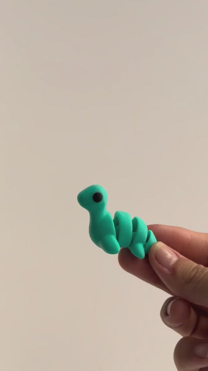 Nessie (Loch Ness Monster) shown moving in a hand.