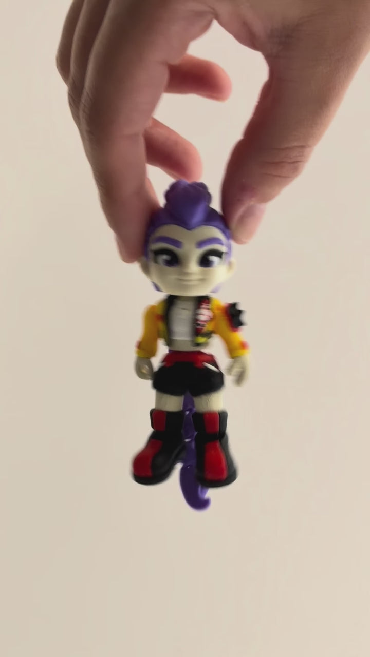 Rumi – K-pop Demon Hunters Figure shown moving in a hand.