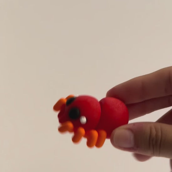 Simon Spider shown moving in a hand.