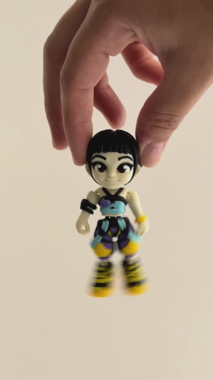 Zoey – K-pop Demon Hunters Figure shown moving in a hand.