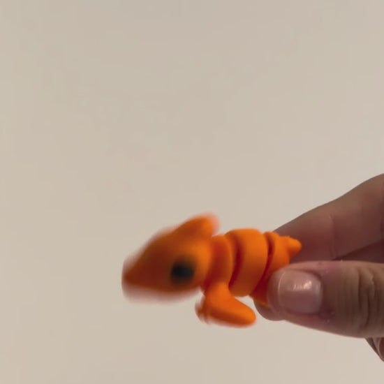 Percy Pterodactyl shown moving in a hand.