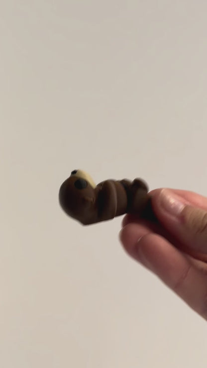 Otter Fidget shown moving in a hand.