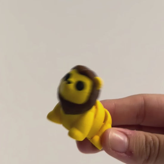 Lion Fidget shown moving in a hand.