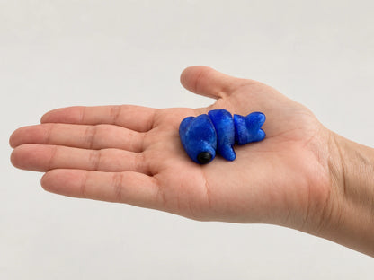 Seal Fidget articulated fidget resting in an open hand.